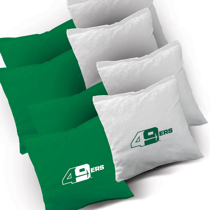 May include: Set of green and white bean bags with the San Francisco 49ers logo. The bean bags are perfect for playing cornhole or other games.