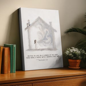 May include: Canvas art print featuring a watercolor illustration of a house with a person inside. The text reads "Better to live on a corner of the roof than share a house with a quarrelsome wife. Proverbs 21:9."