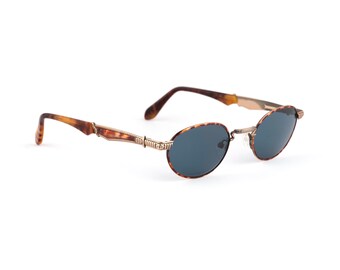 Gafas de sol ovaladas doradas antiguas, lentes azul oscuro, estilo Alaska Adventure de los años 90, talla pequeña, 131 mm, montura carey, Italia NOS