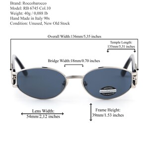 May include: Silver-framed sunglasses with dark lenses. The overall width is 5.35 inches, with a lens width of 2.12 inches and a frame height of 1.53 inches. The temple length is 5.31 inches. The sunglasses are from the 90s, made in Italy.