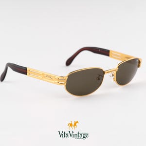 Óculos de sol vintage Sting com armação dourada: óculos de sol ovais steampunk dos anos 90