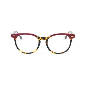 May include: Round eyeglasses with a tortoiseshell pattern on the lower half of the frames and a burgundy upper frame. The glasses have a classic, retro style, suitable for everyday wear.