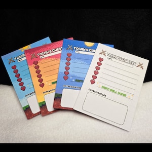 May include: Four printable to-do lists with a pixelated video game theme. Each list has a different color background: blue, orange, red, and white. The lists have a title that says "Today's Quests" and a space for the date. Each list has a section for notes and doodles.