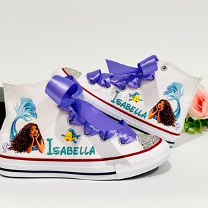 May include: A set of three ceramic mugs with a speckled, matte finish. The mugs are in shades of cream, light gray, and dark gray. Each mug has a simple, minimalist design, perfect for coffee or tea.