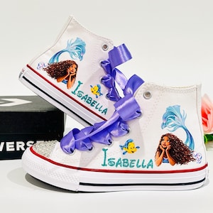 May include: A rustic wooden sign with the text "Welcome to our home" in white lettering. The sign features a distressed finish and a simple, inviting design, perfect for entryway decor.