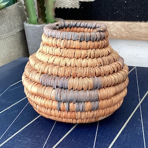 Tiny Native American basket.  Miniature figural woven basket with dog motif.