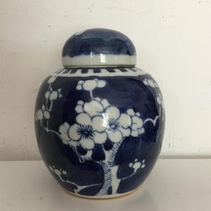 Blue and white ginger jar.  Mid sized hand painted blue and white pottery ginger jar with cherry blossom pattern.