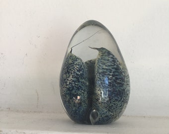 Interesting egg shaped paperweight with blue pods inside.  Signed vintage egg shaped paperweight.