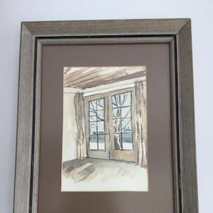 Small artist signed watercolor in vintage frame.  Framed and matted artist signed watercolor painting.