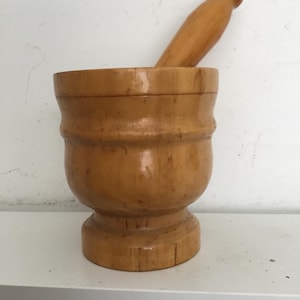 Wooden mortar and pestle.  Mid sized blonde wood mortar and pestle made in Italy.