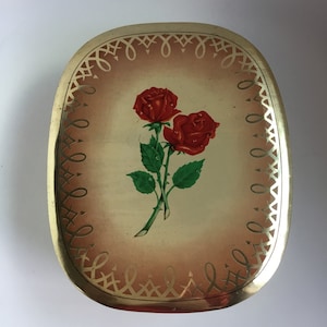 Mid sized vintage lidded tin.  Vintage tin with gold stripes and roses.