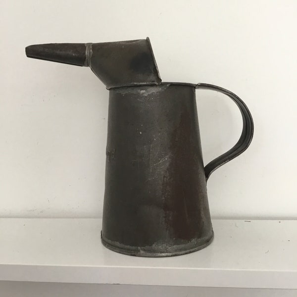 Small vintage metal oil can/pourer.  Vintage rusty-crusty oft repaired 1 quart metal oil can.