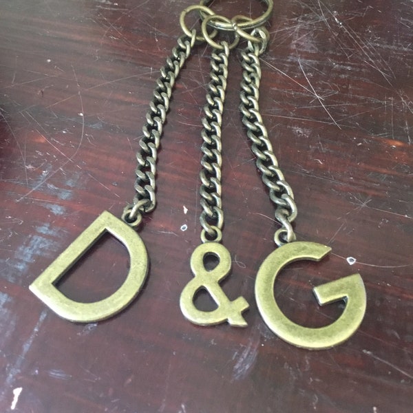 Vintage Dolce and Gabbana key ring.  Dolce and Gabbana brass initial key ring.