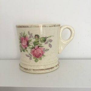 Vintage china shaving mug.  Vintage somewhat crazed and discolored decorated shaving mug.