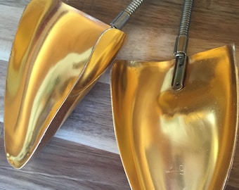 Pair of gold plastic tipped Club shoe stretchers.  Pair of large vintage gold toned metal and plastic shoe stretchers.