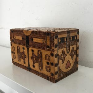 Folk art decorated wood box.  Small vintage wooden box with intricate carved and colored folk art decorations.