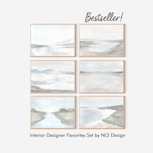 Pode incluir: Seis impressões emolduradas de paisagens em tons neutros. A obra apresenta cenas costeiras e montanhosas abstratas em tons de cinza, bege e branco. O texto "Bestseller!" está no topo e "Interior Designer Favorites Set by NLS Design" na parte inferior.