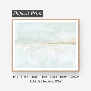 May include: A framed abstract art print with a light blue and beige color palette. The artwork has a textured appearance and is enclosed in a light brown wooden frame. The text "Shipped Print" is at the top. Sizes available: 8x10 to 40x60 inches.