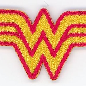 May include: A red and yellow embroidered Wonder Woman logo patch. The logo is a stylized "W" with wings.