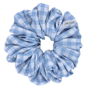 May include: Blue and white gingham scrunchie hair tie with a white label that says "Nikki Nicole".