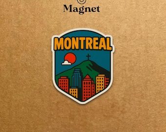 May include: A colorful Montreal magnet with a city skyline, a red sun, and the word "MONTREAL" in bold letters. The magnet has a blue and green background and a white border. The word "Magnet" is above the magnet.