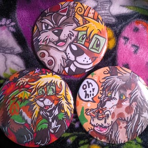 May include: Three circular badges with cartoon animal designs. One depicts a wolf-like creature, another a fox-like character, and the third a brown character with a speech bubble saying "oh hi!".