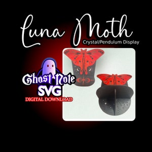 May include: A black and red Luna Moth crystal/pendulum display. The display features a red moth design on top of a black stand. The image also includes the text "Ghost Note SVG DIGITAL DOWNLOAD".