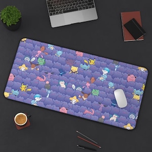 May include: A purple and blue mousepad with a repeating pattern of cartoon Pokemon characters. The characters are in various poses and colors, including pink, yellow, green, and blue.
