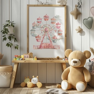 Puede incluir: Una ilustración de acuarela de una noria rosa con góndolas de color pastel sobre un fondo blanco. La ilustración está enmarcada y colgada en una pared blanca en una habitación infantil.