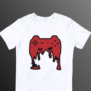 May include: White t-shirt featuring a red and black graphic of a video game controller dripping with red liquid.