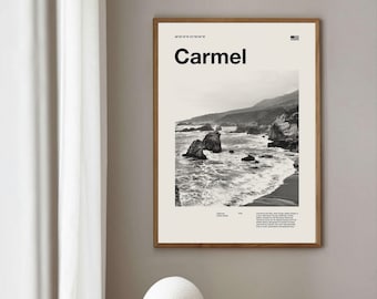 May include: A black and white photograph of a rocky coastline with crashing waves. The image is framed in a light wood frame and has the text "Carmel" and coordinates printed on it.