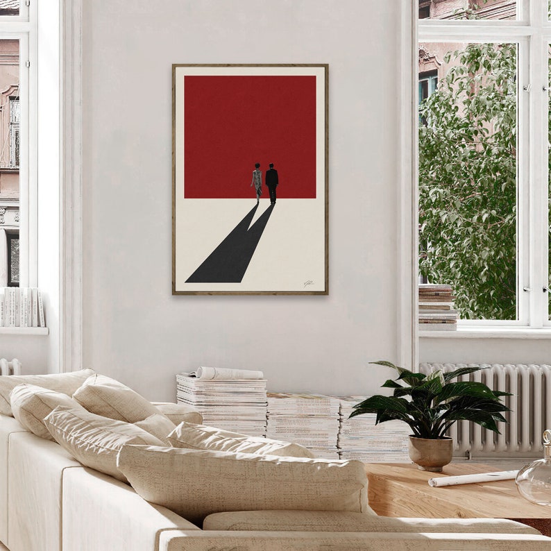 May include: A minimalist art print featuring a silhouette of a couple walking away from a red background. The couple's shadows stretch out in front of them.