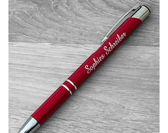 Red ballpoint pen with engraving