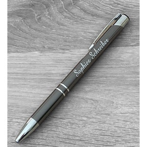 Gray ballpoint pen with engraving