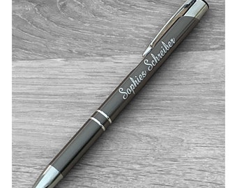 Gray ballpoint pen with engraving