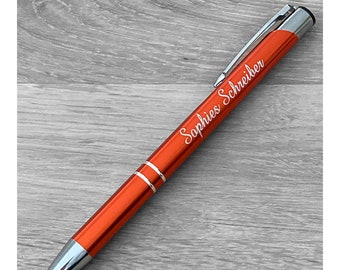 Orange ballpoint pen with engraving