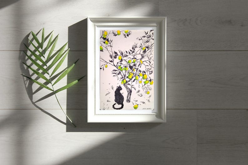 May include: Black and white illustration of a cat sitting under a lemon tree with yellow lemons. The artwork is framed in a white frame.