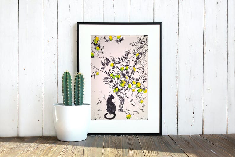 May include: Black and white ink drawing of a cat sitting under a lemon tree with yellow lemons. The drawing is framed in a black frame.