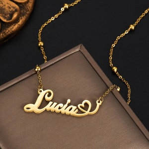 Delicate name necklace with heart and cursive font, comes in silver gold and rose gold
