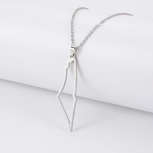 May include: A silver chain necklace with a pendant shaped like the outline of Israel.