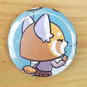Badge fait main panda roux Aggretsuko bande dessinée anime