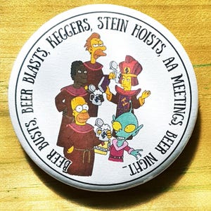 May include: A white button badge with cartoon characters and text. The text around the edge reads "BEER BUSTS, KEGGERS, STEIN HOISTS, AA MEETINGS, BEER NIGHT." The center features cartoon figures holding beer steins.