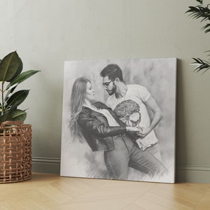 May include: Black and white pencil drawing of a couple dancing. The woman is wearing a black leather jacket and the man is wearing a white t-shirt with a skull design.