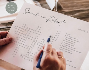 Può includere: Un cruciverba intitolato "Sip and Solve" con i nomi "Sarah and Robert" in alto. Il puzzle viene compilato con una penna blu. Un bicchiere di vino rosso e un piatto con una forchetta sono sullo sfondo.