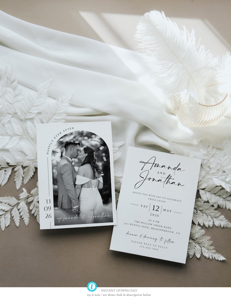 May include: Two white wedding invitation cards with black text. One card features a black and white photo of a couple kissing. The other card has the names "Amanda and Jonathan" and wedding details. The cards are on a neutral background.