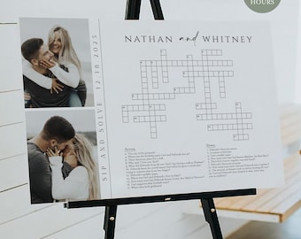 May include: A white wedding crossword puzzle sign on a black easel. The sign features the names "Nathan and Whitney" above a crossword puzzle. Two photos of a couple are on the left side. The text "SIP AND SOLVE 12.18.2025" is on the left side.