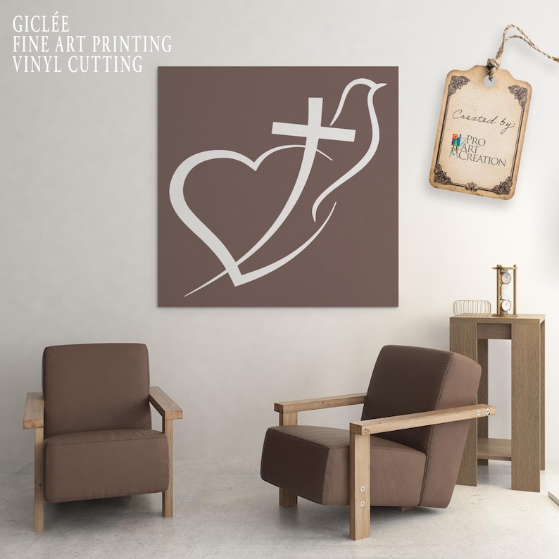 May include: A brown square canvas art print featuring a white heart, cross, and dove design. The text "GICLEE FINE ART PRINTING VINYL CUTTING" is in the upper left corner. The artwork hangs above two brown armchairs.