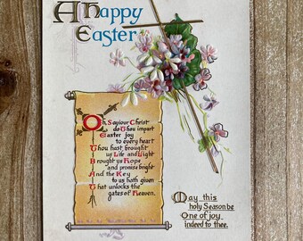 May include: A vintage Easter postcard with a scroll featuring a religious poem. The scroll is decorated with a cross and purple flowers. The text reads "Oh Saviour Christ do thou impart Easter joy to every heart Thou hast brought us Life and light Brought us hope and promise bright And the Key to us hath given that unlocks the gates of Heaven. May this holy Season be One of joy indeed to thee."
