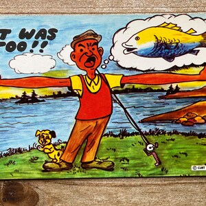 May include: A cartoon illustration of a man fishing. He is standing on a grassy bank next to a river. He is holding a fishing rod and has a thought bubble above his head with a large fish inside. The text "IT WAS TOO!!" is written above the man. A small dog is standing next to the man.