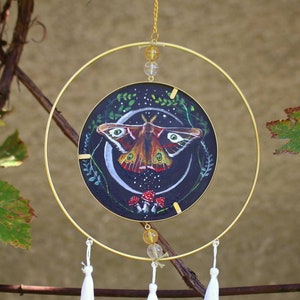 Hand painted double sided round wall mirror with moth, mushrooms and butterflyes painted on cardboard back